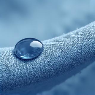 Hydrophobic coating demonstration showing water beading on treated fabric
